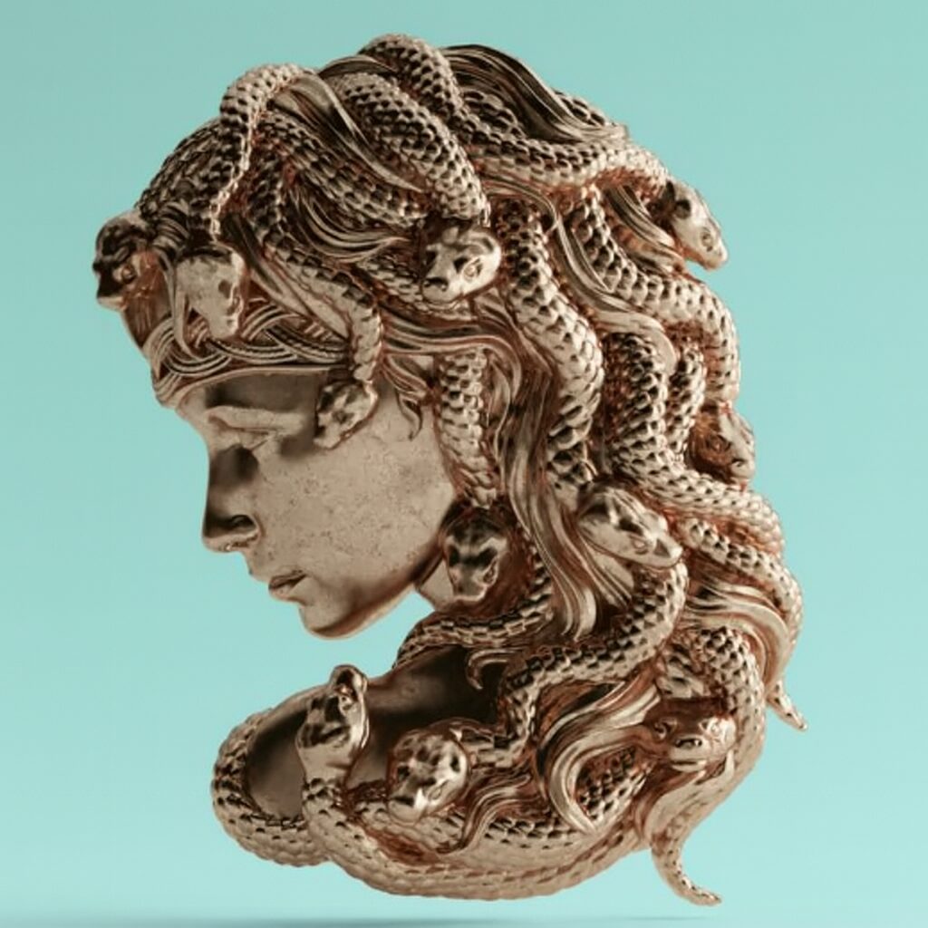 Intricately carved sculpture of a woman's head with snake hair inspired by Medusa.
